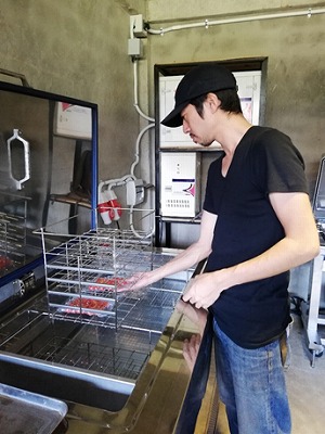 Chef Yamaguchi removing ingredients for the tasting event from a Rapid Freezer. 