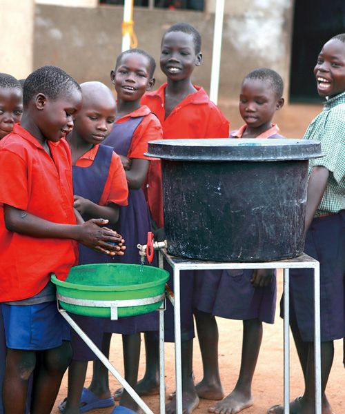 Children in Uganda washing their hands